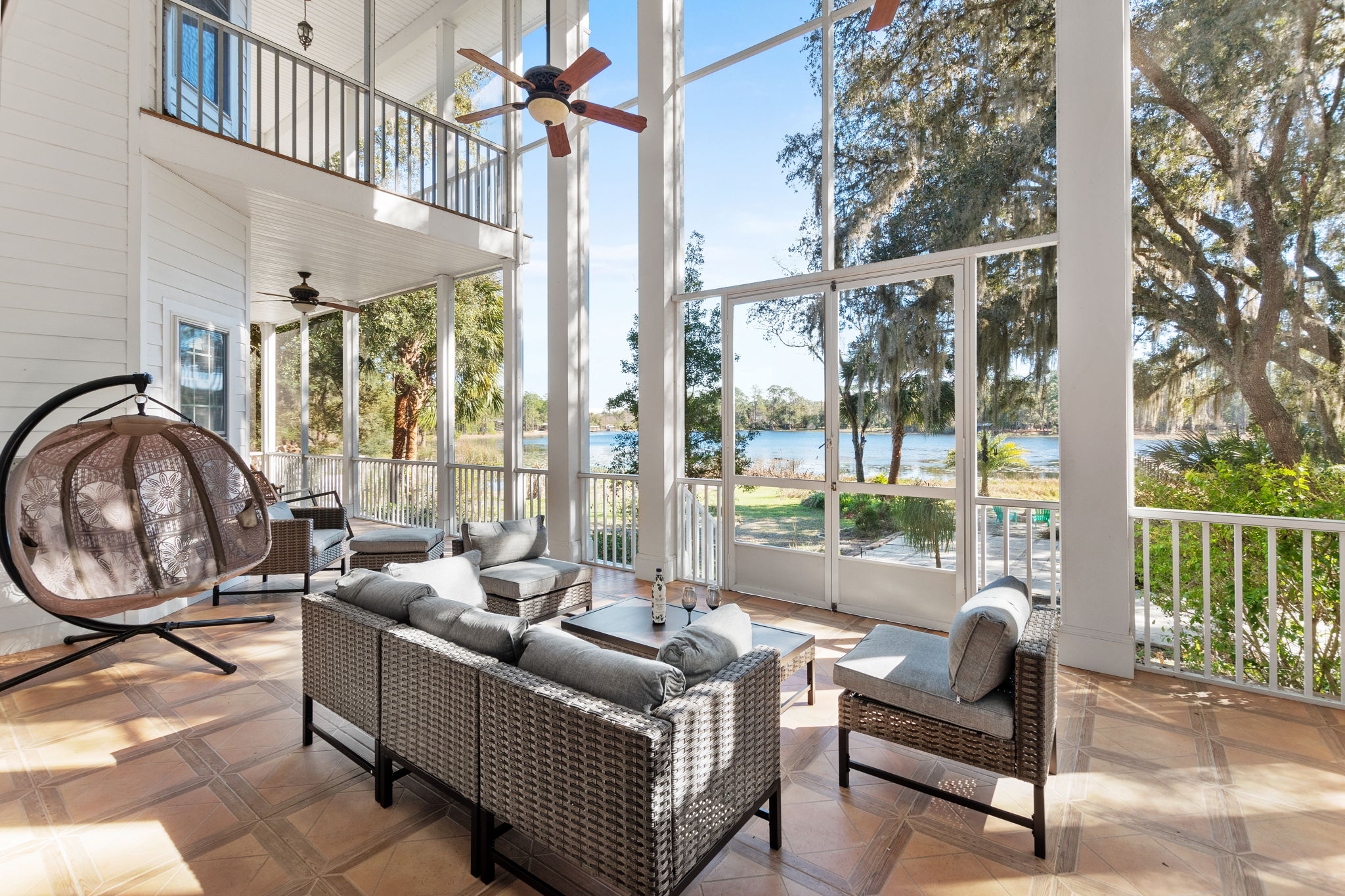 A screened patio at Fern Oak Estate overlooking Lake Como